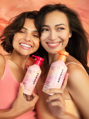 Models holding Eva NYC  Lift Off Volume Shampoo and Conditioner