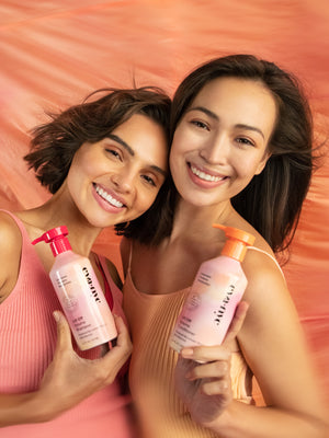 Models holding Eva NYC Lift Off Volume Shampoo and Conditioner