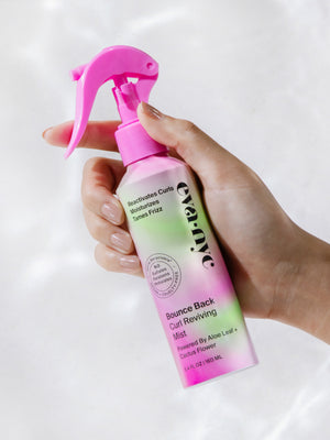 Eva NYC Curl Refresher Spray in hand