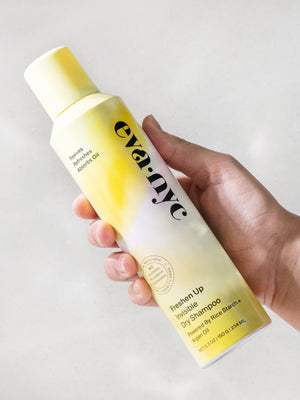 Eva NYC Freshen Up Invisible Dry Shampoo in hand